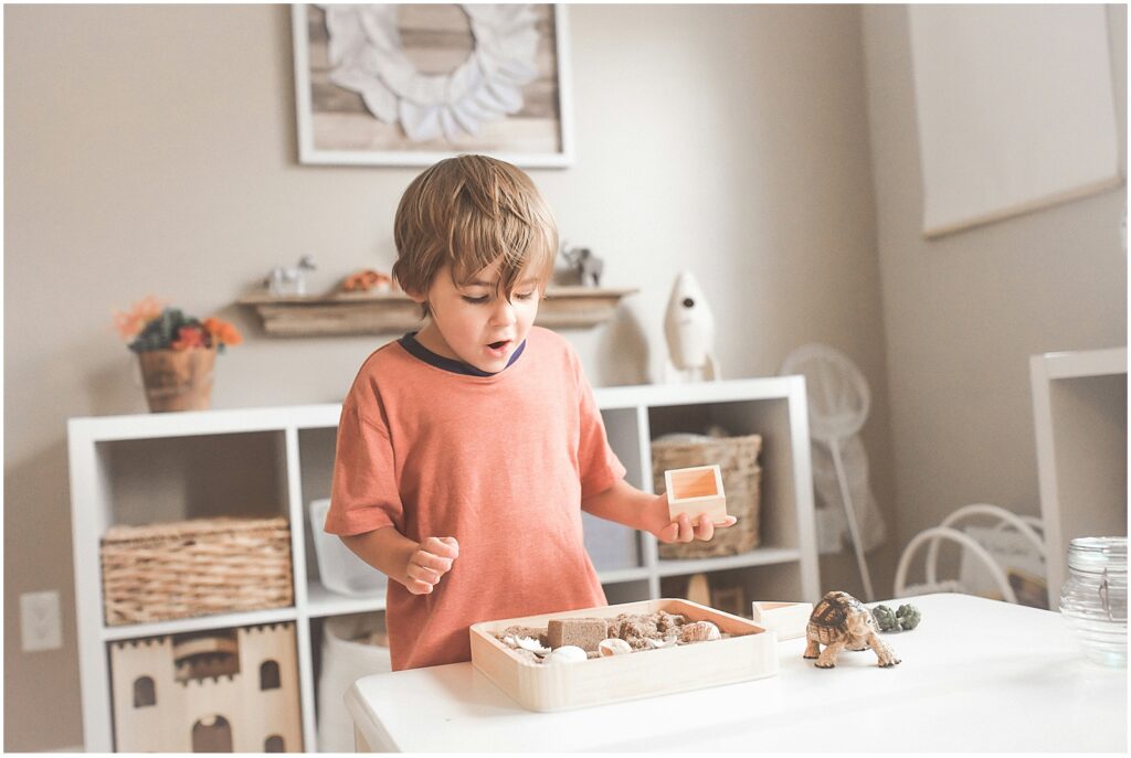 Toddler playing with toys to represent the concept of late talkers intelligence